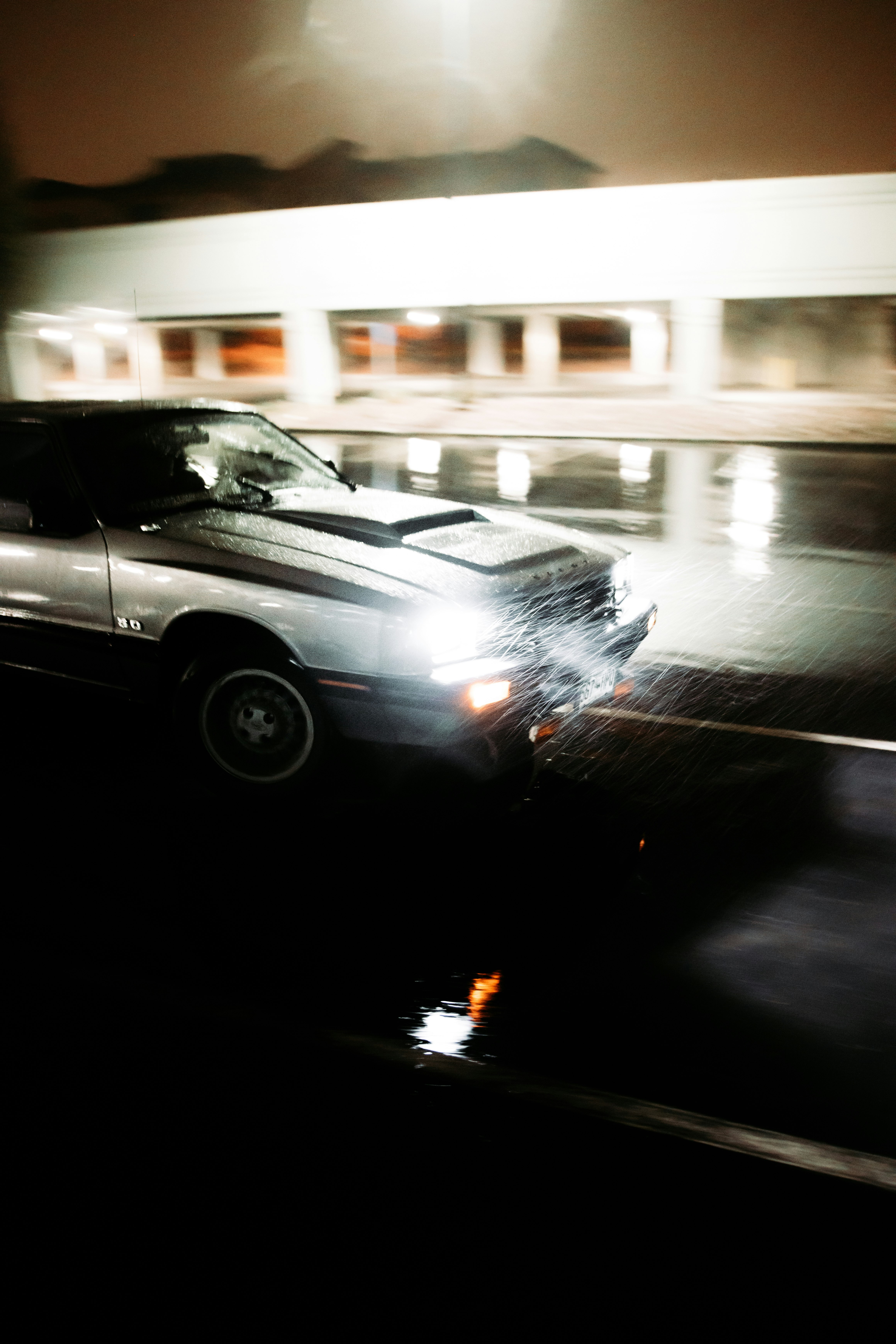 black sedan on road during night time